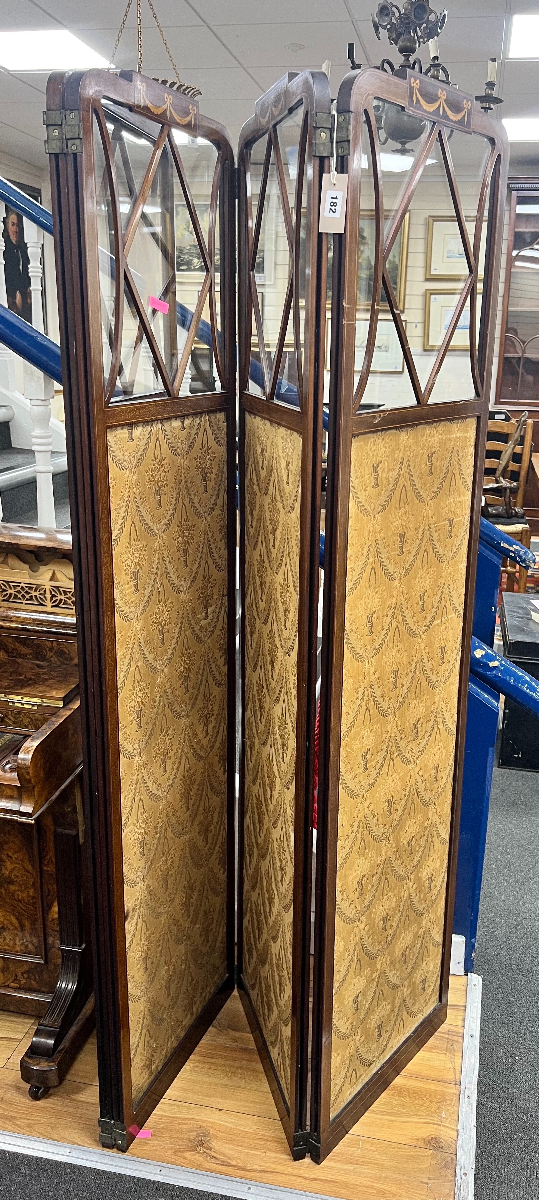 An Edwardian inlaid mahogany four fold part glazed dressing screen, each panel width 46cm height 178cm